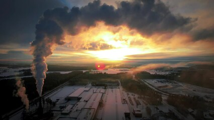 Wall Mural - Drone shot of a countryside under a sunset pinky sky and a smoke