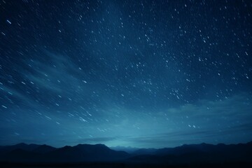 Wall Mural - a long exposure shot of a star-filled night sky, with a faint hint of the milky way visible