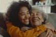 Close-up of a heartwarming moment between a young woman with curly hair and an elderly lady smiling and embracing. Mother's Day celebration.