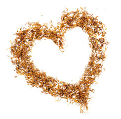 Wall Mural - A pile of shredded tobacco for cigarette rolling in a heart shape, top view, isolated on a transparent background, graphic element