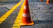 Traffic Cone Amidst Asphalt and Yellow Line