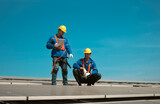 Fototapeta Do przedpokoju - Engineers install solae cell on the roof of factory