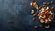 Mixed Nuts in a Bowl on Dark Background - Essential Fats for Healthy Dieting