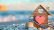 Wooden model house with key and pink wooden heart over blurred beach background , 