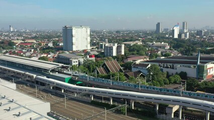 Poster - Jakarta City Train Station and Train. Cityscape in Background. Indonesia