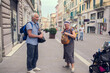 An elderly couple is traveling around Europe