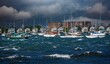 early morning on a stormy day, photo of boats anchored in Newport Marina