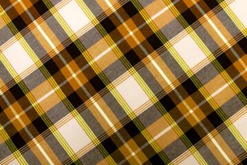 Wall Mural - Texture of yellow checkered fabric. Checkered cotton background