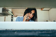 © Luis Herrera/Stocksy - woman talking on the phone