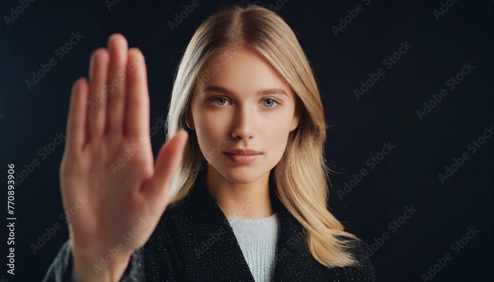 Close up of woman showing stop gesture with hand raising up on black ...