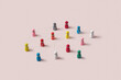 © Yaroslav Danylchenko/Stocksy - Multicolor game pawns connected by thread.