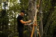© Jelena Markovic/Stocksy - Young male artist creating art in nature