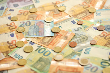 Many European euro money bills and coins. Lot of banknotes of European union currency close up