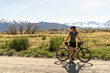 © Christine La/Stocksy - Woman enjoying view on bike outside