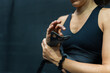 © Raul Navarro/Stocksy - Close-up of a woman getting ready to train at the gym