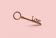© Yaroslav Danylchenko/Stocksy - Vintage bronze key with word Love on clipping path in studio