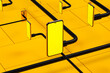 © Marcos Osorio/Stocksy - A yellow cell phone sitting on top of a pile of black cords