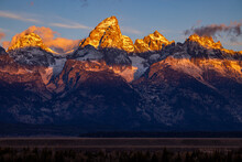 Sunrise Puts A Glow On The Peaks Of The Teton Mountains