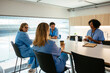 © BONNINSTUDIO/Stocksy - Diverse medical colleagues taking a break in hospital