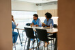 © BONNINSTUDIO/Stocksy - Diverse medical colleagues taking a break in hospital