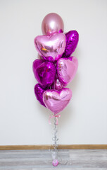 Wall Mural - bunch of pink balloons on a white background, hearts balloons