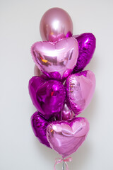 Wall Mural - bunch of pink balloons on a white background, hearts balloons