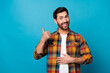 © deagreez - Photo portrait of nice young guy touch stomach good digestion show thumb up wear trendy plaid garment isolated on blue color background
