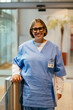© BONNINSTUDIO/Stocksy - Portrait of confident female nurse