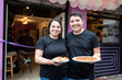 © Alvaro Lavin/Stocksy - Happy couple opening a new bar.