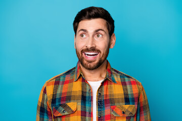 Sticker - Photo of funky ecstatic man with beard dressed plaid shirt staring at impressive offer empty space isolated on blue color background