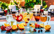 Mixed spritzer wine cocktails selection with fruit in outdoor bar table