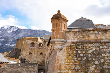 Wall Mural - Turret on the fortified wall of Briançon, a city built by Vauban in the French Alps - Citadel built on top of a rocky spur in a mountainous valley in France