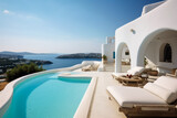 Fototapeta  - Mansion or villa with luxury pool overlooking sea at sunset. Resort hotel on mountain top, scenery of white house and terrace in Greek style. Concept of property, Greece