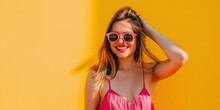 Millennial Woman Wearing Sunglasses And Bright Magenta Summer Fashions On Bright Solid Background