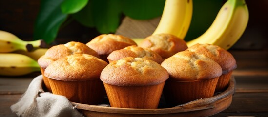 Sticker - A dish of banana muffins made with ripe bananas, a staple food ingredient in baking. This terrestrial plant adds a sweet and moist taste to the baked goods, perfect for a financier recipe