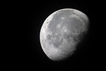 Wall Mural - the moon is 19 days old and is in the waning gibbous phase of its lunar cycle. it is 83% illuminated