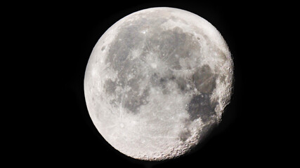 Wall Mural - the moon is 18 days old and is in the waning gibbous phase of its lunar cycle. it is 90% illuminated