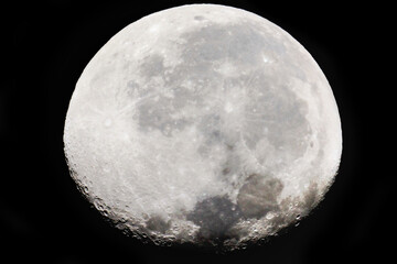 Wall Mural - the moon is 18 days old and is in the waning gibbous phase of its lunar cycle. it is 90% illuminated