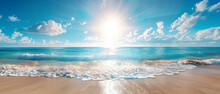 A Picturesque Portrayal Of Sun Glare Casting Over A Pristine Ocean Meeting A White Sand Beach, Framed By A Clear Blue Sky