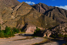 The Rio Grande Meandering Through Beautiful Andean Mountains Between The Villages Of Humahuaca And Tilcara, Quebrada De Humahuaca, Jujuy Province, Northwest Argentina.