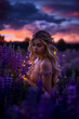 A blonde girl against the background of a blooming purple lupine field with lights and fireflies. A magical night portrait.