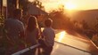 © Justlight - A family sitting on their porch sipping iced tea and admiring their newly cleaned solar panels. In the background the sun is setting . .