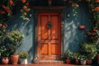 An entryway with a brightly colored orange door. 