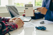 © ArLawKa - Car insurance or rental agreement or purchase or sale agreement with car keys on table Automotive business Car dealer, making deals and signing, close-up photo