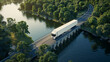A truck bravely navigates over a bridge spanning a powerful river, showcasing strength and adventure