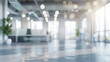 A blurred view of an empty office building, showcasing the haunting stillness and solitude within, Blurred empty open space office. Abstract light bokeh at office interior background for design. 