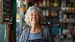 © daniel - Portrait of smiling senior female shop owner