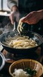 The comforting ritual of adding udon noodles to a pot