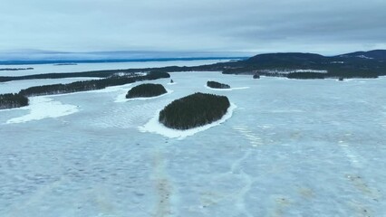 Flying over an arctic scenery on a cloudy day