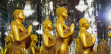 Fototapeta  - Golden standing Buddha statues